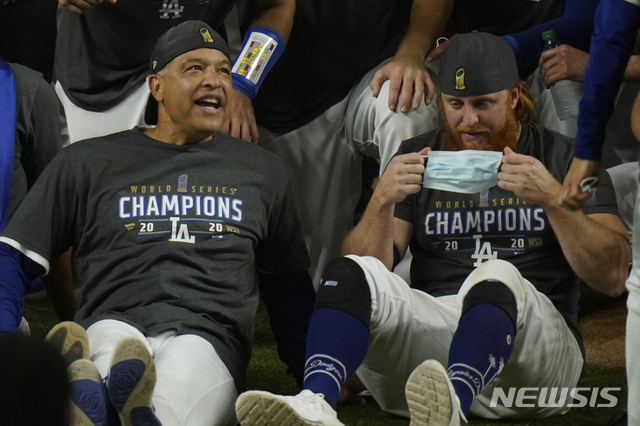 Los Angeles Dodgers celebrate after defeating the Tampa Bay Rays 3-1 to win the baseball World Series in Game 6 Tuesday, Oct. 27, 2020, in Arlington, Texas. (AP Photo/Eric Gay)