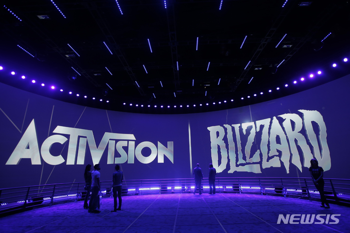 FILE - The Activision Blizzard Booth is shown on June 13, 2013, during the Electronic Entertainment Expo in Los Angeles. Microsoft’s plan to buy video game giant Activision Blizzard for $68.7 billion could have major effects on the gaming industry, transforming the Xbox maker into something like a Netflix for video games by giving it control of many more popular titles. But to get to the next level, Microsoft must first survive a barrage of government inquiries from various countries. An upcoming decision from the United Kingdom to close or escalate its antitrust probe is expected Thursday, Sept. 1, 2022. (AP Photo/Jae C. Hong, File)