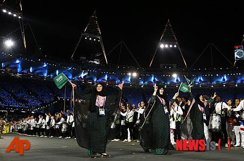 Athletes from Saudi Arabia parade during the Opening Ceremony at the 2012 Summer Olympics, Friday, July 27, 2012, in London. (AP Photo/Matt Dunham)