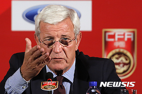 China's newly appointed national football team coach Marcello Lippi speaks during a news conference at a hotel in Beijing, Friday, Oct. 28, 2016. Lippi has urged his China team and the nation to pull together to accomplish the "improbable" task of qualifying for the 2018 World Cup before he begins a thorough overhaul of the struggling football program. (AP Photo/Andy Wong)