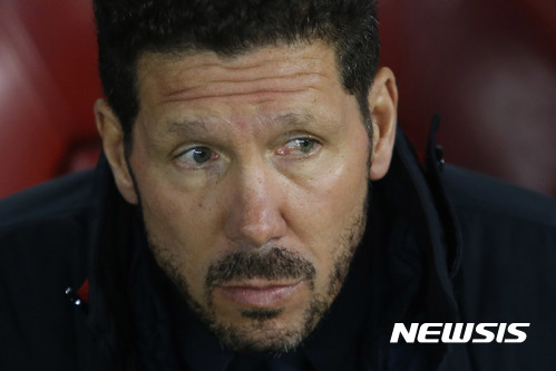 Atletico coach Diego Simeone sits on the bench during a Champions League Group D soccer match between Atletico Madrid and PSV Eindhoven at the Vicente Calderon stadium in Madrid, Spain, Wednesday, Nov. 23, 2016. (AP Photo/Francisco Seco)