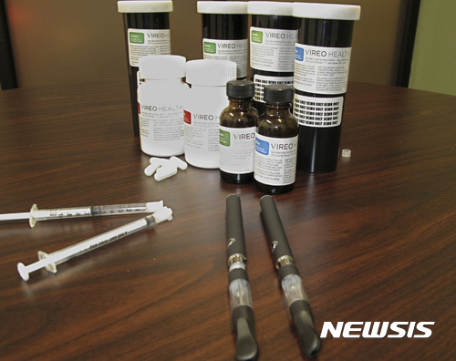 FILE - In this Jan. 5, 2016, file photo, packaging for medical marijuana is displayed at Vireo Health of New York, a dispensary in White Plains, N.Y. New York is loosening some restrictions in its year-old medical marijuana law to boost patient access, but to the dismay of some pot advocates, there is no sign the state is in any hurry to join seven other states in embracing full legalization. (AP Photo/Jennifer Peltz, File)