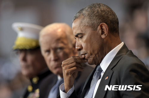 President Barack Obama, right, Vice President Joe Biden, center, and Joint Chiefs Chairman Gen. Joseph Dunford, left, listen as Defense Secretary Ash Carter speaks during an Armed Forces Full Honor Farewell Review for the president, Wednesday, Jan. 4, 2017, at Conmy Hall, Joint Base Myer-Henderson Hall, Va. (AP Photo/Susan Walsh)