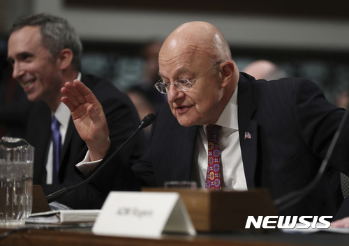 Director of National Intelligence James Clapper, right, with Defense Undersecretary of Defense for Intelligence Marcel Lettre II, testifies on Capitol Hill in Washington, Thursday, Jan. 5, 2017, before the Senate Armed Services Committee hearing: "Foreign Cyber Threats to the United States." (AP Photo/Manuel Balce Ceneta)