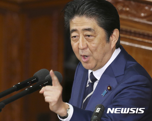 Japanese Prime Minister Shinzo Abe delivers his policy speech during a Diet session at the lower house of parliament in Tokyo, Friday, Jan. 20, 2017. Abe said Friday that he plans to visit the U.S. as soon as possible to meet with President-elect Donald Trump. Speaking on the eve of Trump's inauguration, he called the U.S.-Japan alliance an "unchanging principle" for his country's foreign and security policy.(AP Photo/Koji Sasahara)