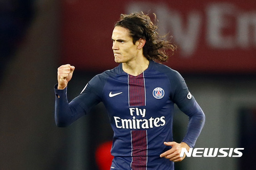 FILE- In this Sunday, Nov. 6, 2016 file photo, PSG's Edinson Cavani reacts after their first goal during their French League One soccer match between PSG and Marseille at the Parc des Princes stadium in Paris, France. Sunday's table-topping clash between defending champion Paris Saint-Germain and league leader Monaco pits two of the league's most feared strikers against each other. (AP Photo/Francois Mori, File)