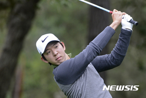 Seung-Yul Noh, of South Korea, follows his shot from the eighth tee of the Spyglass Hill Golf Course during the first round of the AT&T Pebble Beach National Pro-Am golf tournament Thursday Feb. 9, 2017, in Pebble Beach, Calif. (David Royal/Monterey Herald via AP)