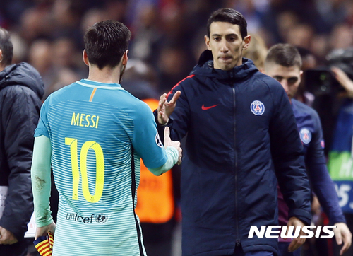 PSG's Angel Di Maria, right, shakes hands with Barcelona's Lionel Messi after the Champion's League round of 16, first leg soccer match between Paris Saint Germain and Barcelona at the Parc des Princes stadium in Paris, Tuesday, Feb. 14, 2017. PSG won the match 4-0. (AP Photo/Francois Mori)