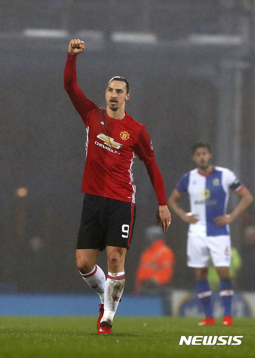 Manchester United's Zlatan Ibrahimovic celebrates scoring his side's second goal against Blackburn Rovers during the English FA Cup, fifth round soccer match at Ewood Park, Blackburn, England, Sunday Feb. 19, 2017. (Martin Rickett/PA via AP)