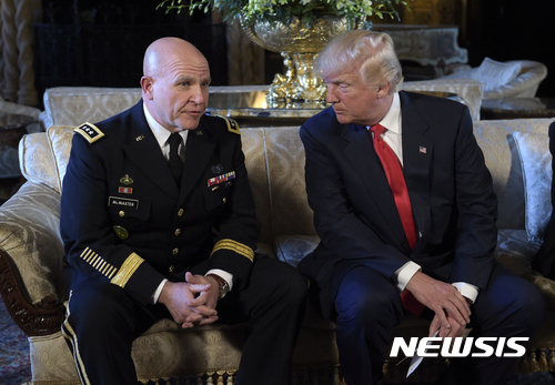President Donald Trump, right, listens as Army Lt. Gen. H.R. McMaster, left, talks at Trump's Mar-a-Lago estate in Palm Beach, Fla., Monday, Feb. 20, 2017, where Trump announced that McMaster will be the new national security adviser. (AP Photo/Susan Walsh)