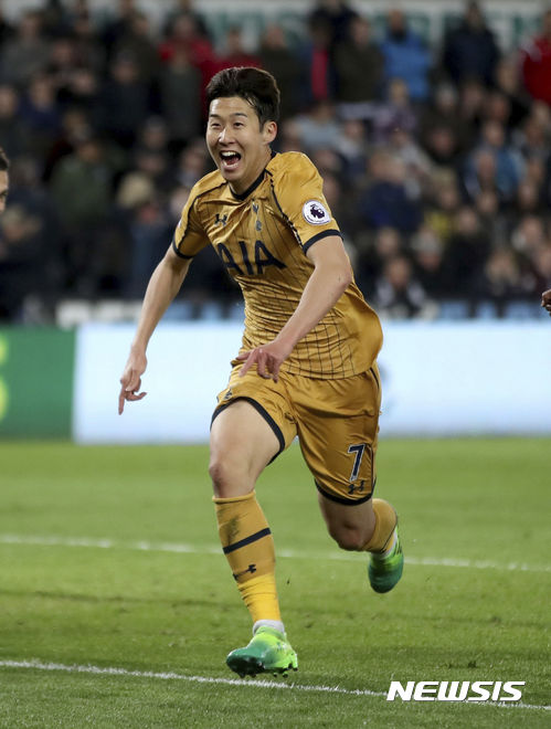 Tottenham Hotspur's Son Heung-Min celebrates scoring his side's second goal of the game during the English Premier League soccer match Swansea City against Tottenham Hotspur's at the Liberty Stadium, Swansea, Wales, Wednesday April 5, 2017. (Nick Potts/PA via AP)