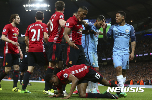 Players argue and push during the English Premier League soccer match between Manchester City and Manchester United at the Etihad Stadium in Manchester, England,Thursday, April 27, 2017.(AP Photo/Dave Thompson)