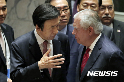 South Korea's Foreign Minister Yun Byung-se, left, talks with U.S. Secretary of State Rex Tillerson after a meeting of the Security Council at United Nations headquarters, Friday, April 28, 2017. (AP Photo/Richard Drew)