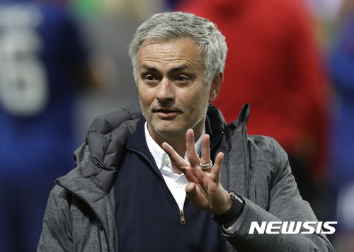 Manchester manager Jose Mourinho shows four fingers after winning 2-0 during the soccer Europa League final between Ajax Amsterdam and Manchester United at the Friends Arena in Stockholm, Sweden, Wednesday, May 24, 2017. (AP Photo/Michael Sohn)