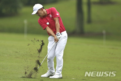 Kang Sung-hoon of South Korea strikes his ball on the 7th hole during the four-ball matches of the 2018 EurAsia Cup golf tournament at Glenmarie Golf & Country Club in Shah Alam, Malaysia, Friday, Jan. 12, 2018. (AP Photo/Sadiq Asyraf)