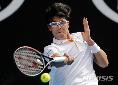 South Korea's Chung Hyeon makes a forehand return to Germany's Alexander Zverev during their third round match at the Australian Open tennis championships in Melbourne, Australia, Saturday, Jan. 20, 2018. (AP Photo/Vincent Thian) 