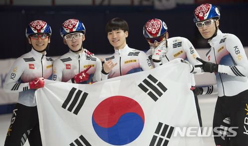 Members of team South Korea celebrate after winning the men&#039;s 5000-meter relay final at the ISU world short-track speedskating championships in Montreal, Sunday, March 18, 2018. (Graham Hughes/The Canadian Press via AP)