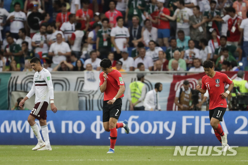 South Korea&#039;s Son Heung-min, center, celebrates after scoring his side&#039;s first goal during the group F match between Mexico and South Korea at the 2018 soccer World Cup in the Rostov Arena in Rostov-on-Don, Russia, Saturday, June 23, 2018. (AP Photo/Lee Jin-man)