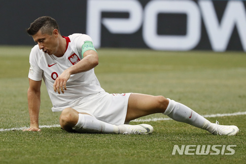 Poland&#039;s Robert Lewandowski reacts after missing a chance to score during the group H match between Japan and Poland at the 2018 soccer World Cup at the Volgograd Arena in Volgograd, Russia, Thursday, June 28, 2018. (AP Photo/Eugene Hoshiko)