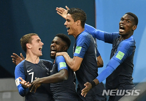 France&#039;s Samuel Umtiti, second from left, is congratulated by his teammates France&#039;s Antoine Griezmann, Raphael Varane and Paul Pogba, from left, after scoring the opening goal during the semifinal match between France and Belgium at the 2018 soccer World Cup in the St. Petersburg Stadium in St. Petersburg, Russia, Tuesday, July 10, 2018. (AP Photo/Martin Meissner)