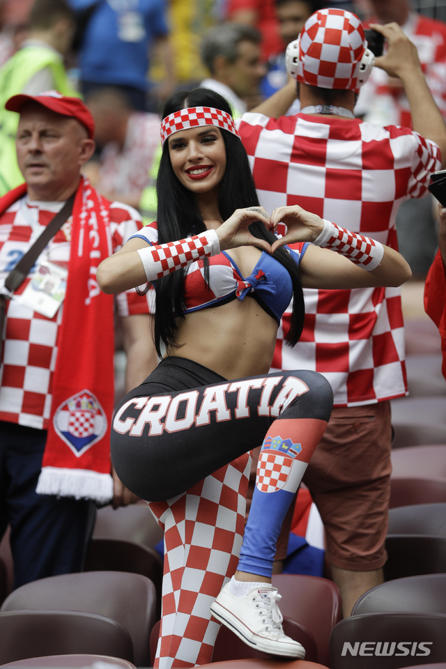 A fan poses for photographers before the final match between France and Croatia at the 2018 soccer World Cup in the Luzhniki Stadium in Moscow, Russia, Sunday, July 15, 2018. (AP Photo/Matthias Schrader)