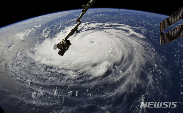 This photo provided by NASA shows Hurricane Florence from the International Space Station on Monday, Sept. 10, 2018, as it threatens the U.S. East Coast. Forecasters said Florence could become an extremely dangerous major hurricane sometime Monday and remain that way for days. (NASA via AP)