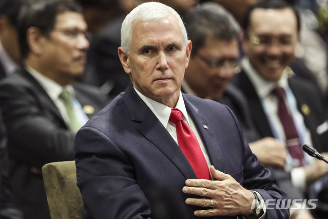 U.S. Vice President Mike Pence attends the 13th East Asian Summit Plenary on the sidelines of the 33rd ASEAN summit in Singapore, Thursday, Nov. 15, 2018. (AP Photo/Yong Teck Lim)