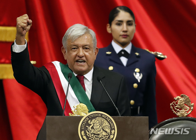 Mexico&#039;s new President Andres Manuel Lopez Obrador speaks during his inaugural ceremony at the National Congress in Mexico City, Saturday, Dec. 1, 2018. (AP Photo/Eduardo Verdugo)