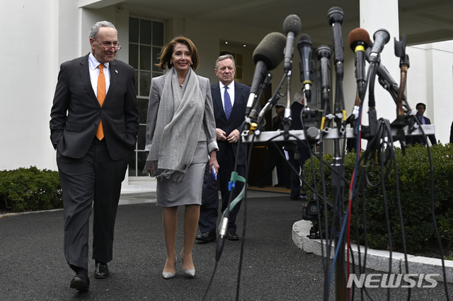 House Speaker Nancy Pelosi of Calif., center, walk with Senate Minority Leader Sen. Chuck Schumer of N.Y., left, and Sen. Dick Durbin, D-Ill., right, to speak with reporters following their meeting with President Donald Trump on border security at the White House in Washington, Wednesday, Jan. 9, 2019. (AP Photo/Susan Walsh)