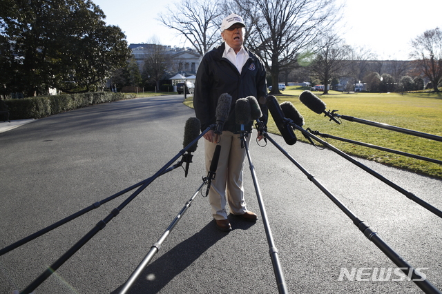 President Donald Trump speaks to the media as he leaves the White House, Thursday Jan. 10, 2019, in Washington, en route for a trip to the border in Texas as the government shutdown continues. (AP Photo/Jacquelyn Martin)