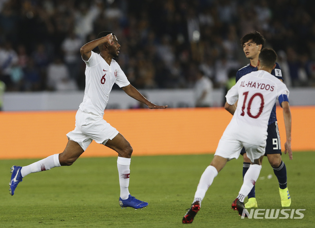 Qatar&#039;s midfielder Abdelaziz Hatem, left, celebrates after he scored his team&#039;s second goal during the AFC Asian Cup final match between Japan and Qatar in Zayed Sport City in Abu Dhabi, United Arab Emirates, Friday, Feb. 1, 2019. (AP Photo/Kamran Jebreili)