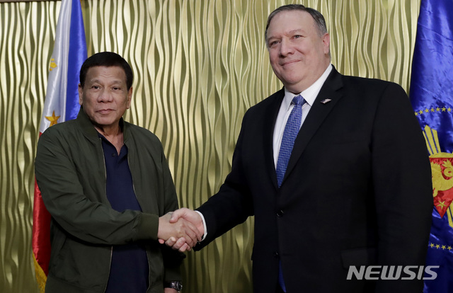 Philippine President Rodrigo Duterte, left, greets U.S. State Secretary Mike Pompeo upon arrival at Villamor Air Base in suburban Pasay city southeast of Manila, Philippines, Thursday, Feb. 28, 2019. Pompeo, who joined U.S. President Donald Trump in the second summit with North Korean leader Kim Jong-un in Vietnam, is here for talks on the two countries&#039; relations as well as the mutual defense treaty. (AP Photo/Bullit Marquez, POOL)