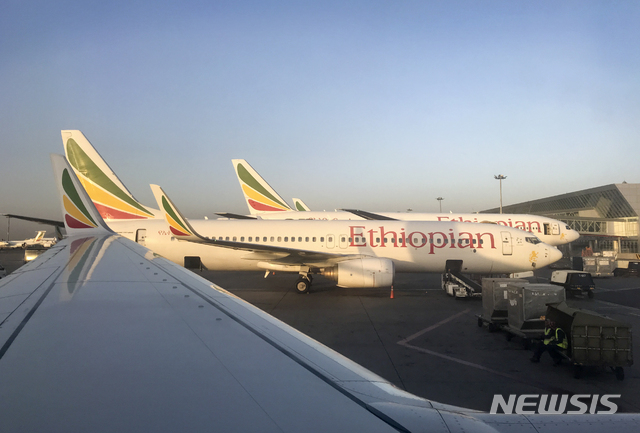 This photo taken Monday, Feb. 11, 2019 shows an Ethiopian Airlines Boeing 737-800 parked at Bole International Airport in Addis Ababa, Ethiopia. An Ethiopian Airlines Boeing 737 Max 8 jetliner carrying 157 people crashed shortly after takeoff from the Ethiopian capital Sunday, March 10, 2019 killing everyone aboard, authorities said. (AP Photo/Ben Curtis)