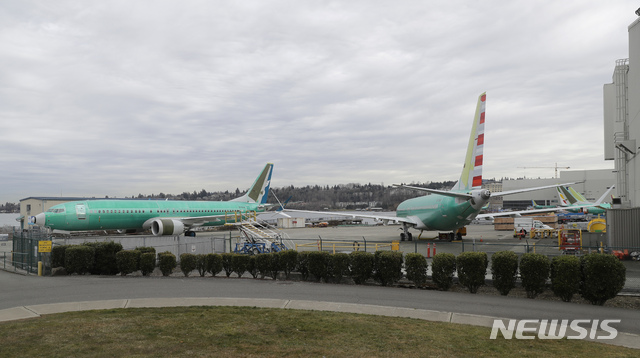 Two Boeing 737 MAX 8 airplanes sit parked at Boeing Co.&#039;s Renton Assembly Plant, Monday, March 11, 2019, in Renton, Wash. Airlines in several countries grounded the same model jetliner Monday following Sunday&#039;s crash of an Ethiopian Airlines Boeing 737 Max 8, the second devastating crash of one of the planes in five months. (AP Photo/Ted S. Warren)
