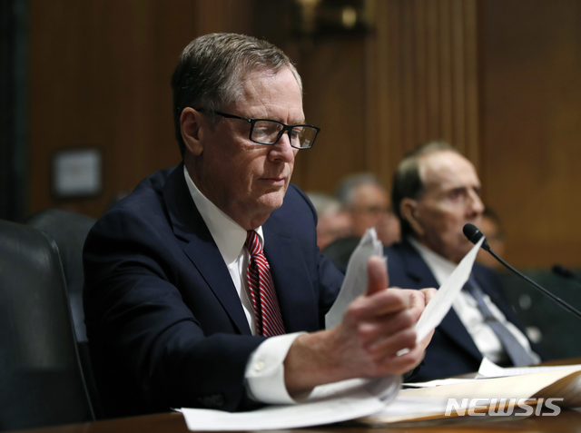 FILE - In this March 14, 2017, file photo, United States Trade Representative-nominee Robert Lighthizer, foreground, looks at documents during his confirmation hearing on Capitol Hill in Washington. Lighthizer, the top U.S. trade negotiator, suggests that the U.S. and China are nearing an agreement that would end their trade conflict, but wouldn&#039;t commit to a specific time frame. &quot;Our hope is that we are in the final weeks of having an agreement,&quot; U.S. Trade Representative Lighthizer told the Senate Finance Committee. (AP Photo/Manuel Balce Ceneta, File)