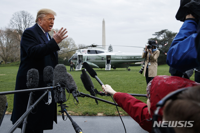 President Donald Trump speaks with reporters before boarding Marine One on the South Lawn of the White House, Friday, April 5, 2019, in Washington. (AP Photo/Evan Vucci)