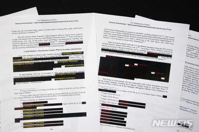 Special counsel Robert Mueller&#039;s redacted report on the investigation into Russian interference in the 2016 presidential election is photographed Thursday, April 18, 2019, in Washington. (AP Photo/Jon Elswick)