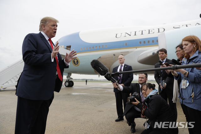 President Donald Trump talks to the media before boarding Air Force One for a trip to Indianapolis to speak at the National Rifle Association annual meeting, Friday, April 26, 2019, in Andrews Air Force Base, Md. (AP Photo/Evan Vucci)