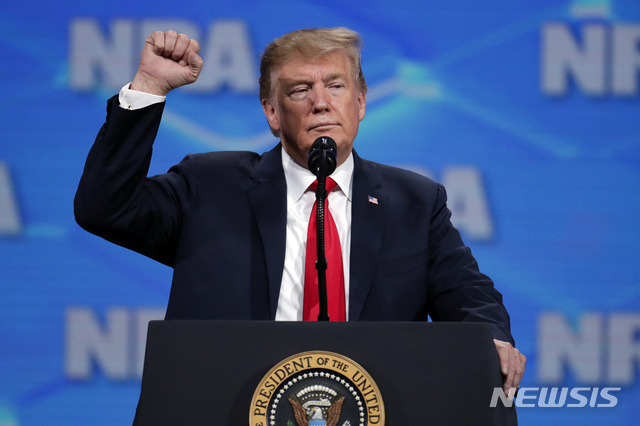 President Donald Trump speaks at the National Rifle Association Institute for Legislative Action Leadership Forum in Lucas Oil Stadium in Indianapolis, Friday, April 26, 2019. (AP Photo/Michael Conroy)