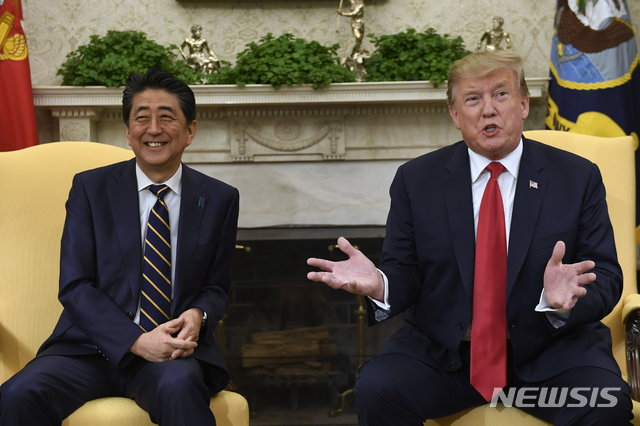 President Donald Trump, right, speaks while meeting with Japanese Prime Minister Shinzo Abe, left, in the Oval Office of the White House in Washington, Friday, April 26, 2019. The meeting comes on the heels of the recent nuclear talks between North Korean leader Kim Jong Un and President Vladimir Putin of Russia. (AP Photo/Susan Walsh)