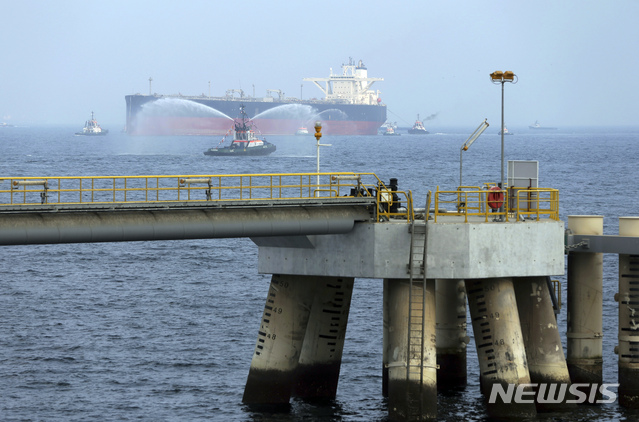 FILE - In this Sept. 21, 2016 file photo, an oil tanker approaches to the new Jetty during the launch of the new $650 million oil facility in Fujairah, United Arab Emirates. The United Arab Emirates said Sunday, May 12, 2019 that four commercial ships near Fujairah &quot;were subjected to sabotage operations&quot; after false reports circulated in Lebanese and Iranian media outlets saying there had been explosions at the Fujairah port. (AP Photo/Kamran Jebreili)