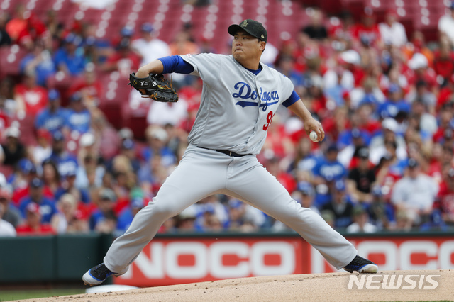 Los Angeles Dodgers starting pitcher Hyun-Jin Ryu throws in the first inning of a baseball game against the Cincinnati Reds, Sunday, May 19, 2019, in Cincinnati. (AP Photo/John Minchillo)