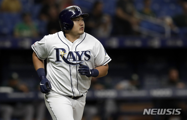 Tampa Bay Rays' Ji-Man Choi, of South Korea, watches his two-run home run off Oakland Athletics relief pitcher Joakim Soria during the eighth inning of a baseball game Monday, June 10, 2019, in St. Petersburg, Fla. (AP Photo/Chris O'Meara)