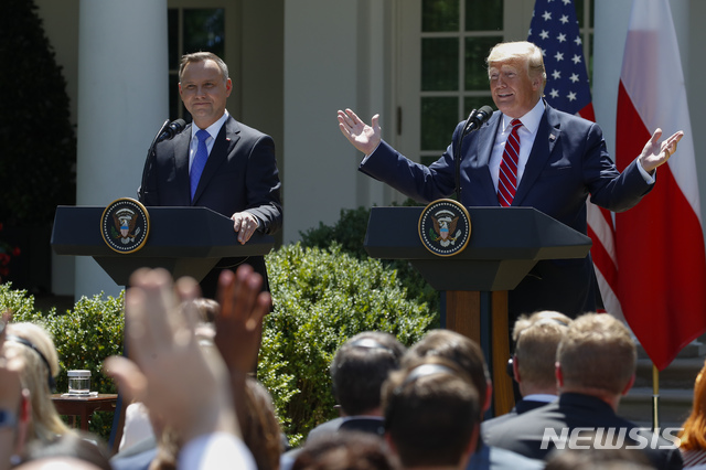 President Donald Trump speaks during a news conference with Polish President Andrzej Duda in the Rose Garden of the White House, Wednesday, June 12, 2019, in Washington. (AP Photo/Alex Brandon)