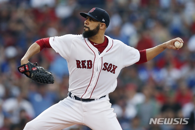 Boston Red Sox&#039;s David Price pitches during the first inning of a baseball game against the Los Angeles Dodgers in Boston, Sunday, July 14, 2019. (AP Photo/Michael Dwyer)