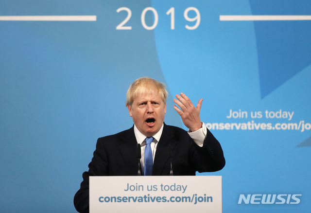 Boris Johnson gestures as he speaks after being announced as the new leader of the Conservative Party in London, Tuesday, July 23, 2019. Brexit champion Boris Johnson won the contest to lead Britain&#039;s governing Conservative Party on Tuesday, and will become the country&#039;s next prime minister. (AP Photo/Frank Augstein)