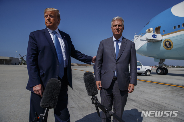 President Donald Trump and new National security adviser Robert O&#039;Brien talk with reporters before boarding Air Force One at Los Angeles International Airport, Wednesday, Sept. 18, 2019, in Los Angeles. (AP Photo/Evan Vucci)