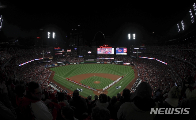 Busch Stadium is seen during introductions before Game 1 of the National League Championship Series baseball game between the St. Louis Cardinals and the Washington Nationals Friday, Oct. 11, 2019, in St. Louis. (AP Photo/Tim Donnelly)