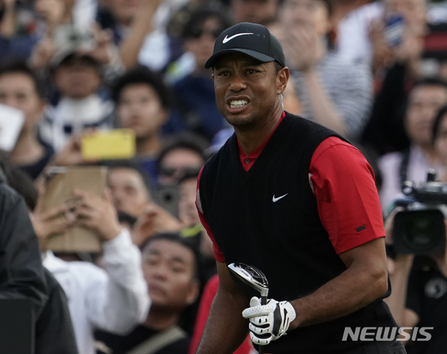 Tiger Woods of the United States watches his tee shot on the 8th hole during the final round of the Zozo Championship PGA Tour at the Accordia Golf Narashino country club in Inzai, east of Tokyo, Japan, Sunday, Oct. 27, 2019. (AP Photo/Lee Jin-man)