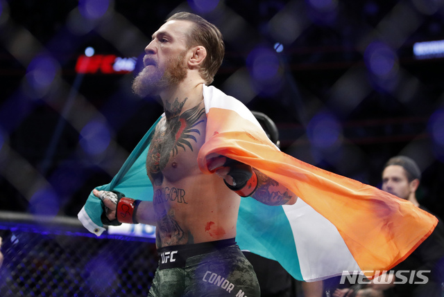 Conor McGregor celebrates after defeating Donald &quot;Cowboy&quot; Cerrone during a UFC 246 welterweight mixed martial arts bout, Saturday, Jan. 18, 2020, in Las Vegas. (AP Photo/John Locher)